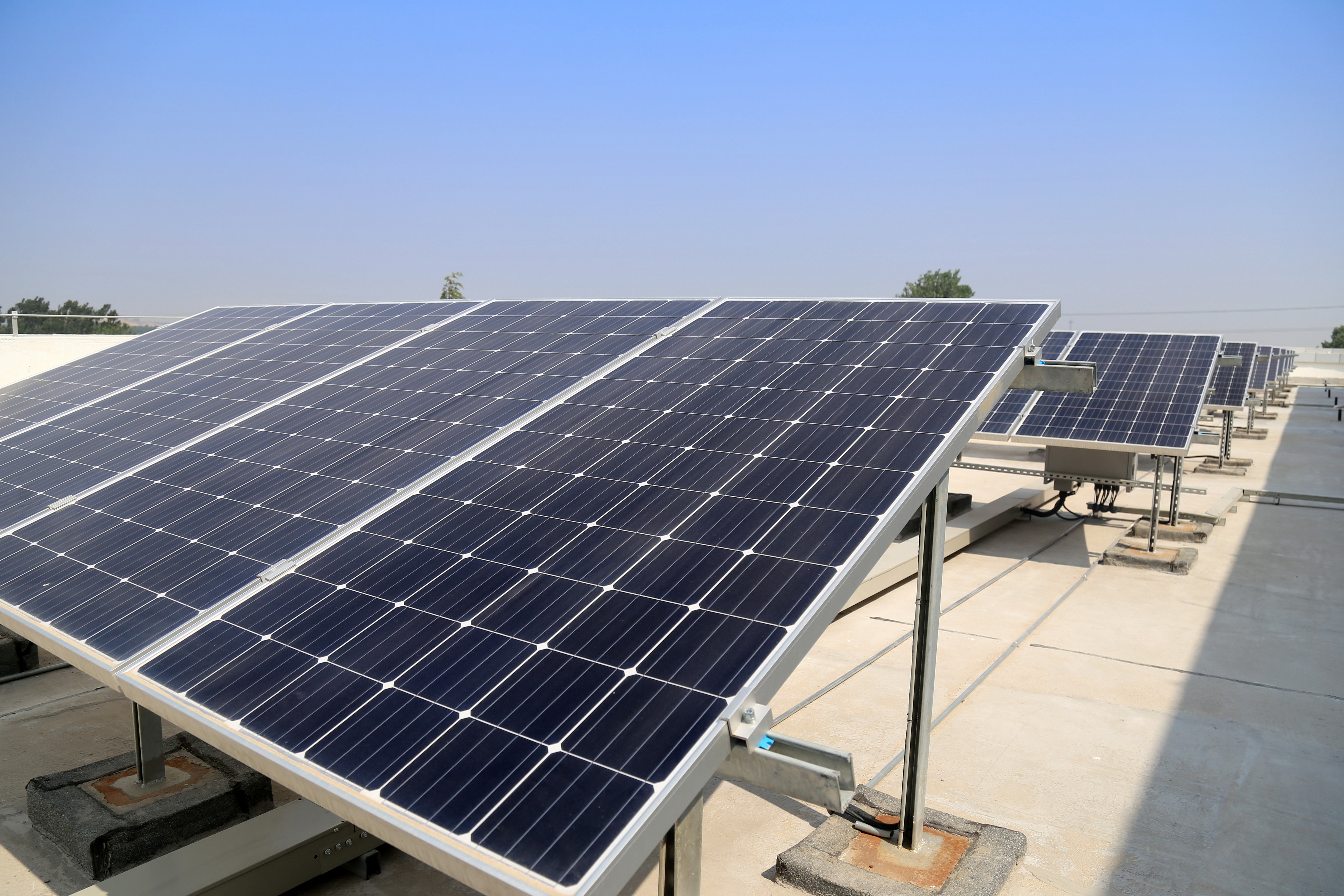 Solar panels on a Philippine rooftop at golden hour